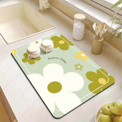 Kitchen countertop draining mat made of tech fabric, used as