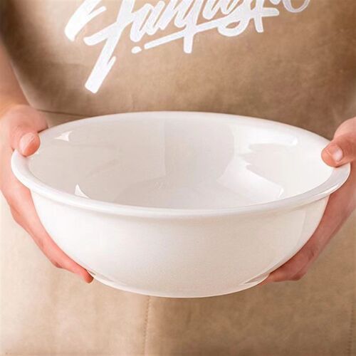 Plain white ceramic salad bowl deep soup plate chopped peppe