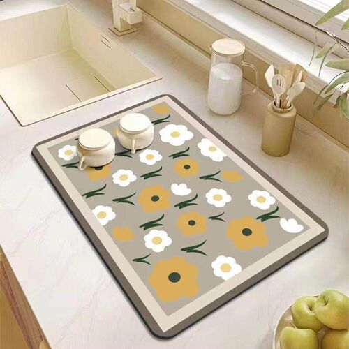 Kitchen countertop draining mat made of tech fabric, used as