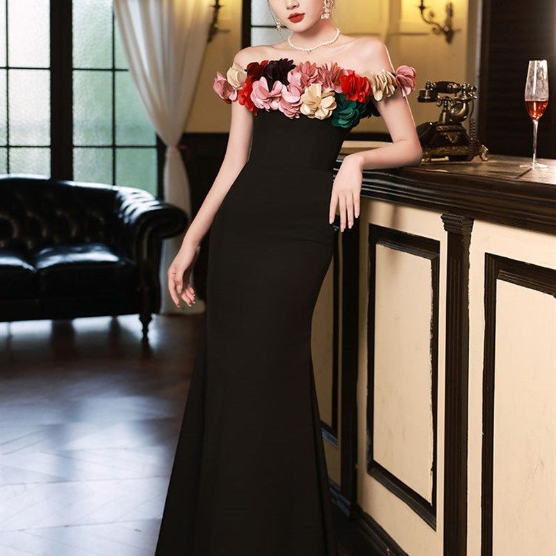 黑色年会晚礼服2024新款一字肩高端气质名媛主持人鱼尾裙高级感女