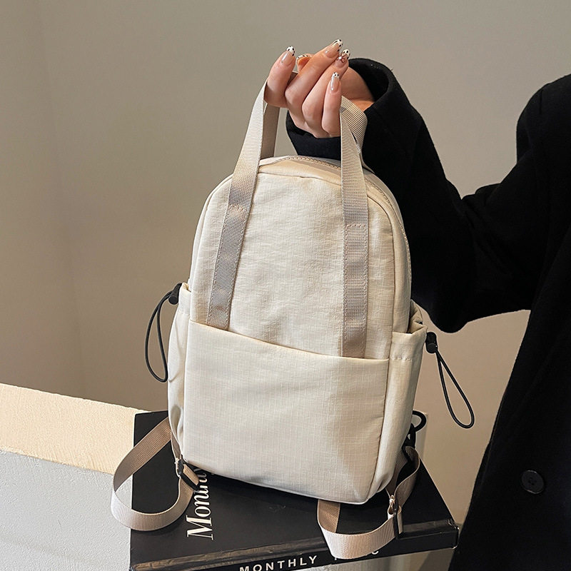 单肩斜挎两用包包女士2026新款轻便旅行胸包通勤布包逛街双肩背包