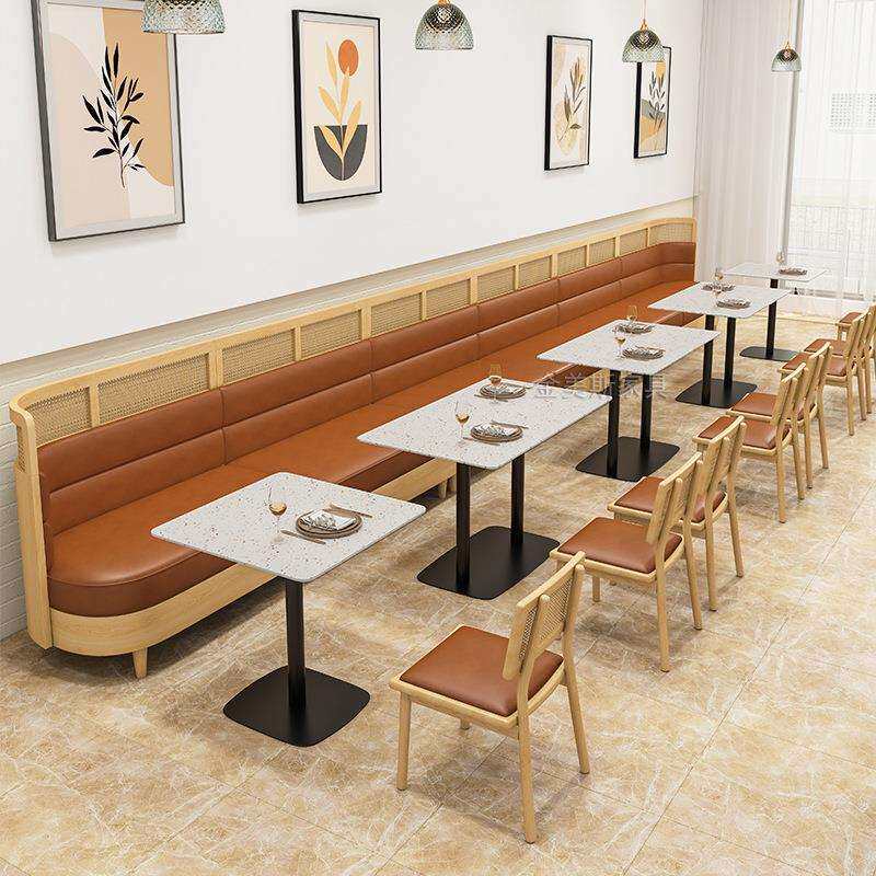 西餐厅靠墙卡座沙发水磨石桌藤编椅商用饭店餐饮餐厅桌椅组合