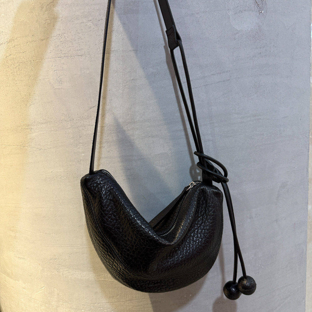 TANGFEEL2025新款黑色真皮单肩包女羊皮泡泡纹斜挎包高级感小众通