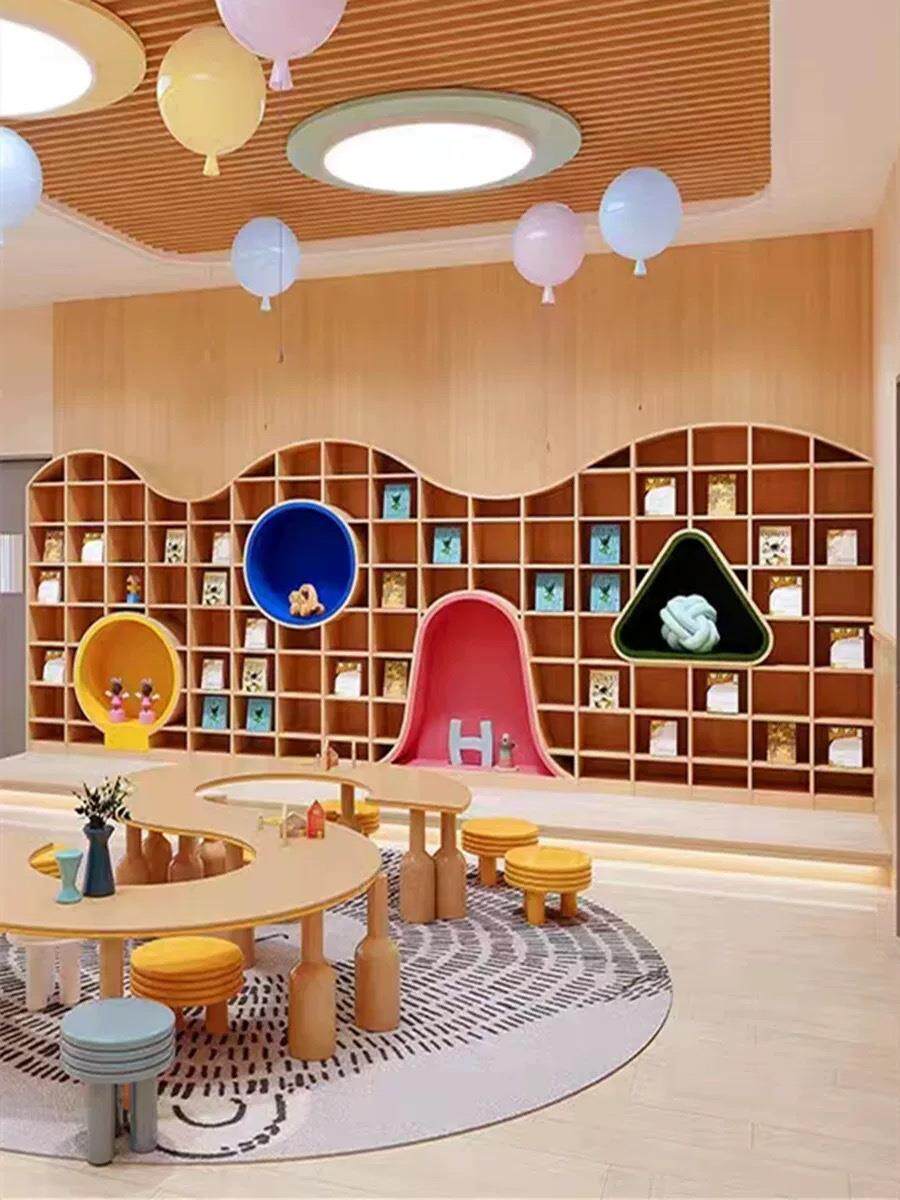 定制幼儿园书店主题环创墙面异形书柜展示儿童书吧培训波浪顶文化