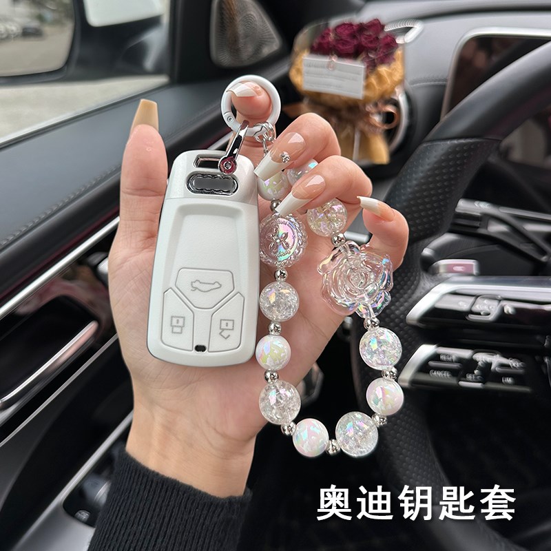 适用奥迪车钥匙套23-24新款A4LQ5LA5高级感车用壳女士汽车挂件扣