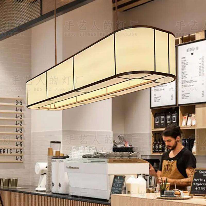 酒店中餐厅椭圆形吊灯自助茶餐厅饭店收银台岛台餐桌米色布艺吊灯