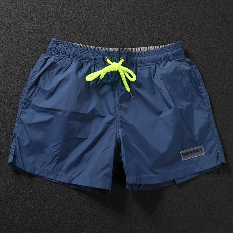 男装休闲短裤夏季三分运动纯色简约宽松裤衩外穿百搭潮流孔雀蓝色