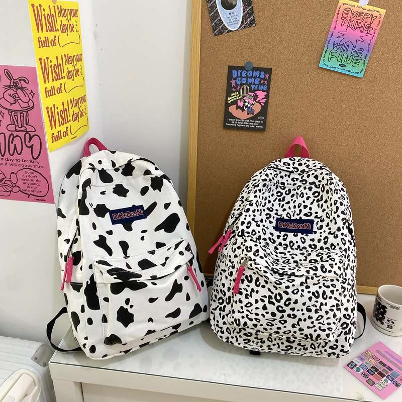 日系原宿风休闲帆布奶牛纹豹纹双肩包ins高中大学生书包女潮背包
