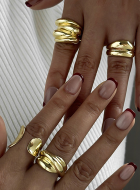 A set of irregular multi-layered wrapped gold rings  women