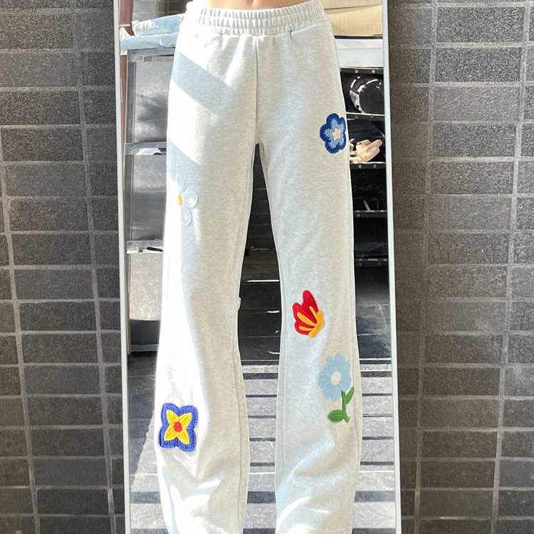 刺绣花卉设计感弯刀卫裤微喇长裤