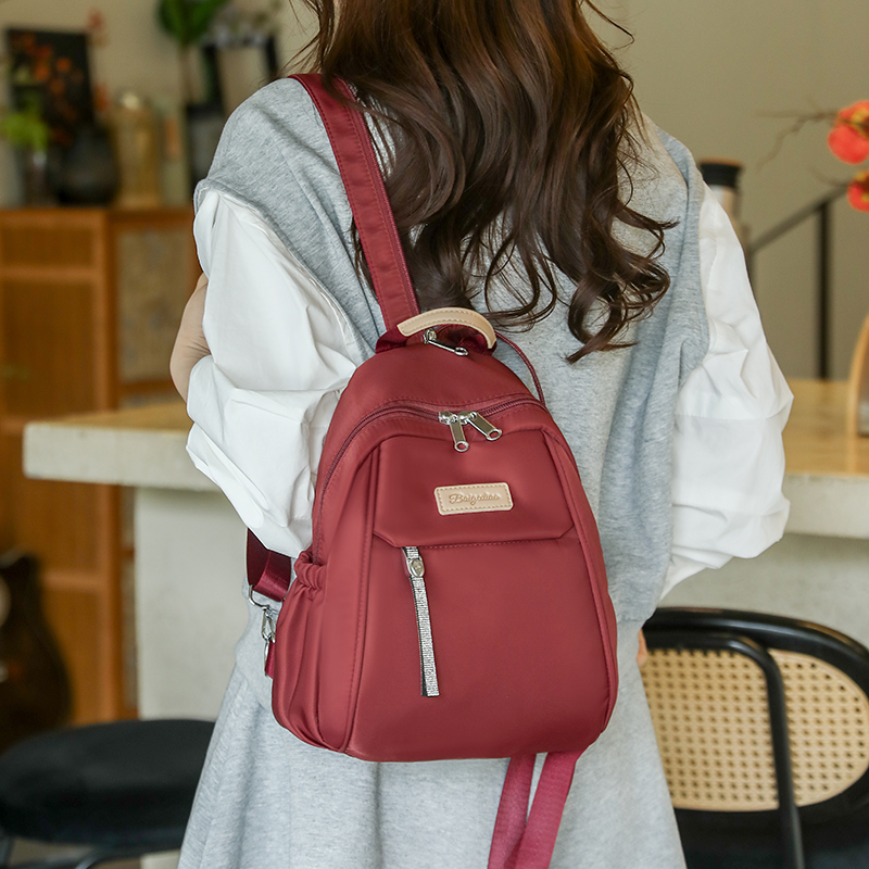 双肩包超轻2025新款高级感小众牛津布布上班通勤旅行背包小型轻便