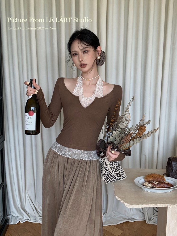 Model wearing a brown lace-trimmed top and matching long skirt
