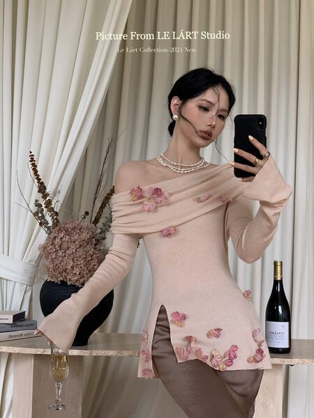 Woman wearing a pale pink off-shoulder floral embellished dress