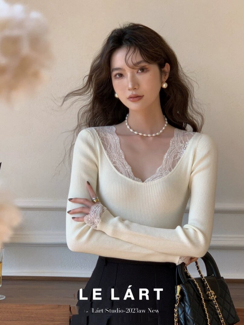 Cream long-sleeve lace-trim knit top worn by a model