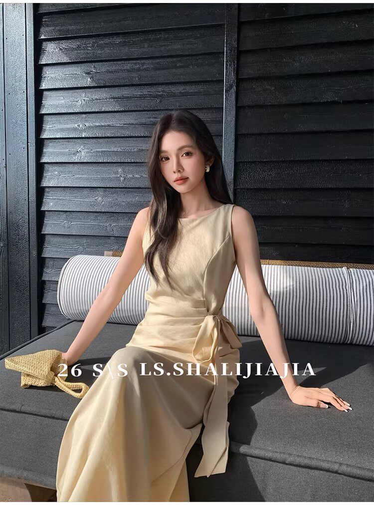 Beige sleeveless maxi dress worn by a model