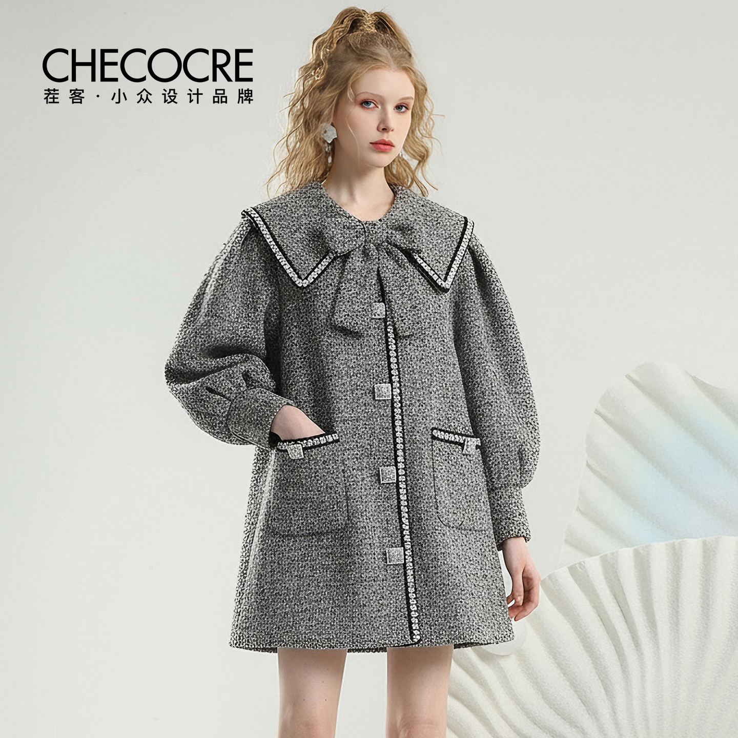 茬客娃娃领钻扣蝴蝶结上衣