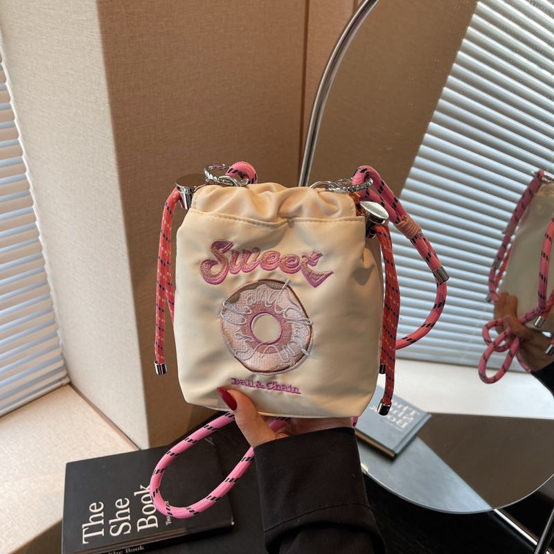 韩系小众可爱百搭甜甜圈撞色帆布小包包女2025夏季新款斜挎水桶包