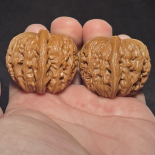 平谷元宝42尺一物一图文玩核桃已经打底双翘头一字底蟒皮纹