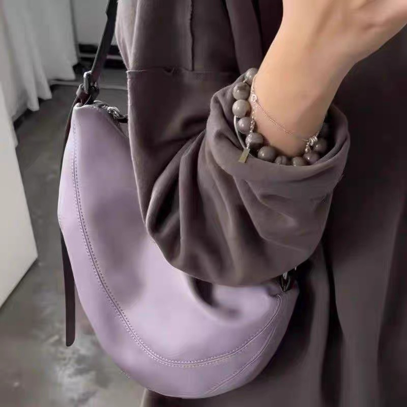 撞色软皮饺子包包女2025新款轻奢小众高级感通勤单肩斜挎包马鞍包