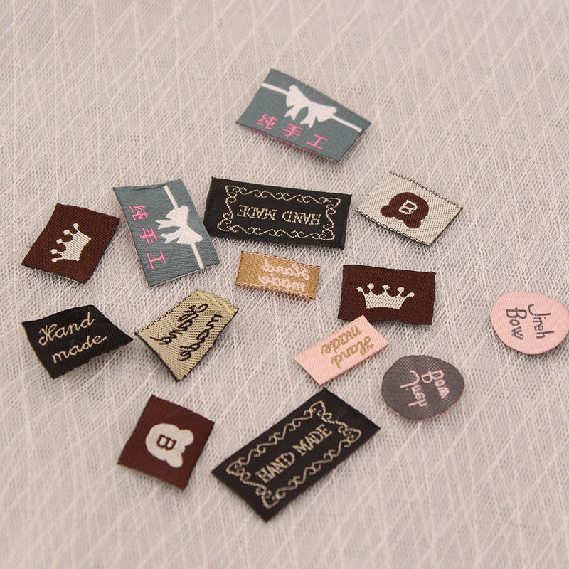 100个装织唛布艺标签背标diy发绳皮筋贴标发饰头饰蝴蝶结材料配件