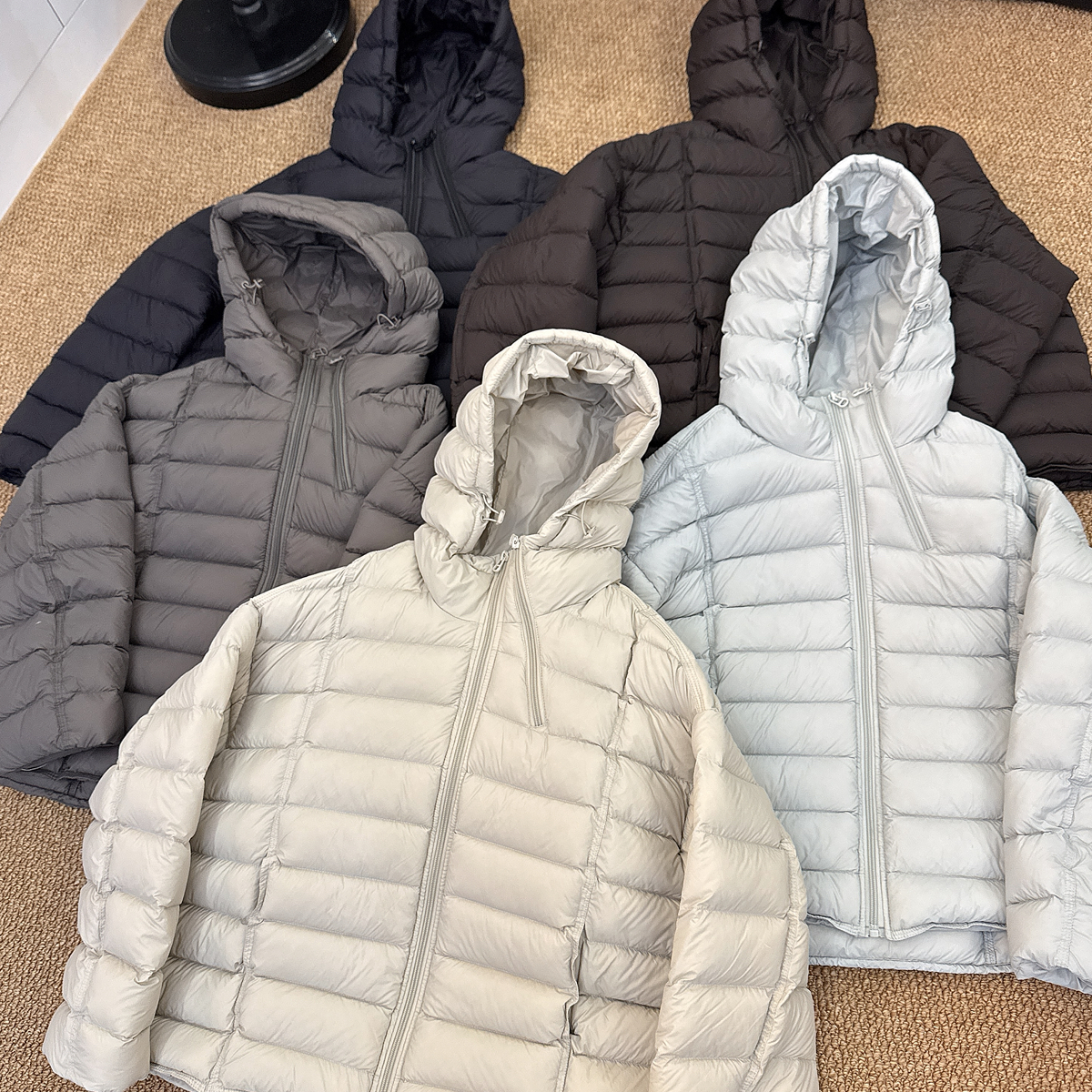 2025冬季新款时尚简约轻薄欧货双拉链排骨连帽保暖羽绒服外套女