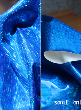 寒冰蓝色炫彩镜面拉丝仿皮布料 设计师面料反光防水服装创意布料