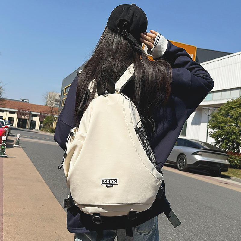 新款双肩包男纯色两用帅气休闲港风女学生上课运动骑行斜背包潮