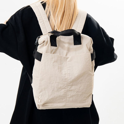 新款帆布简约时尚双肩包女轻便大容量旅行背包通勤电脑学生书包男