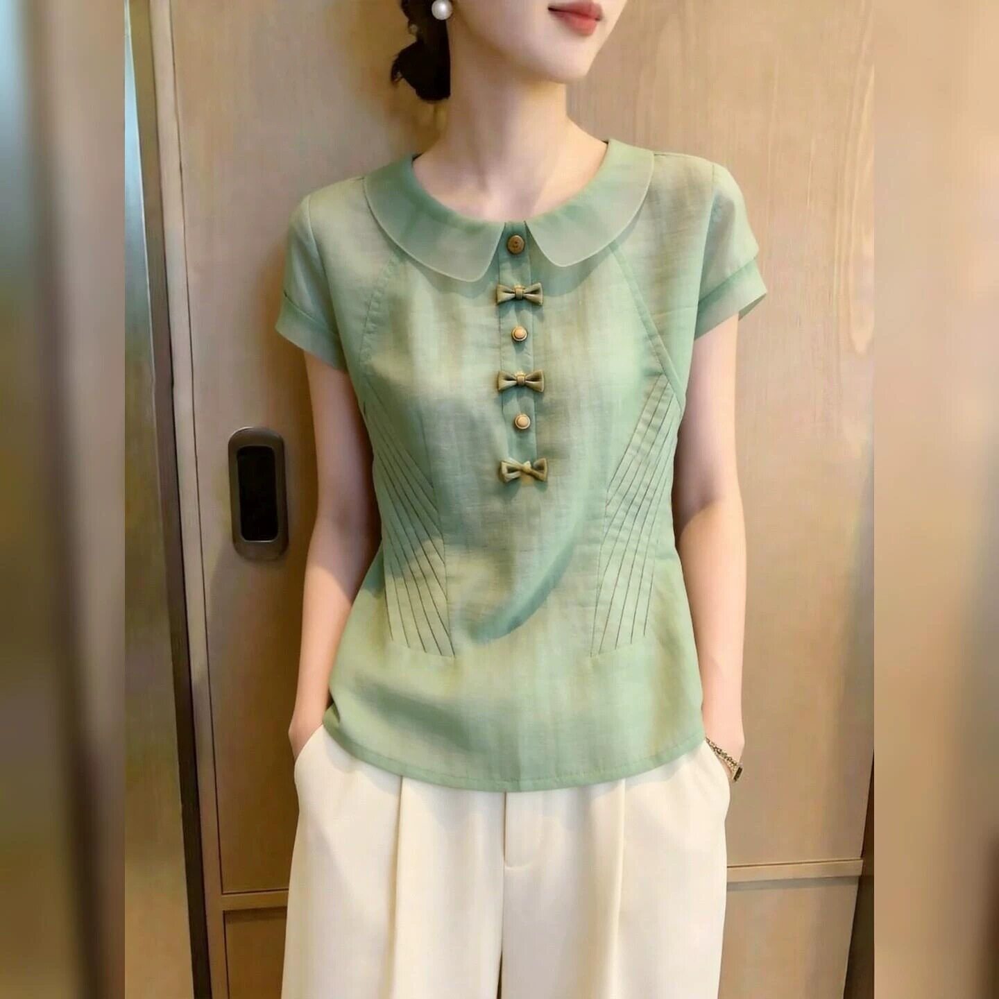 绿色短袖衬衫女夏季通勤风娃娃领蝴蝶结装饰上衣超好看时尚2026年