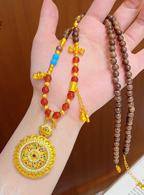 金包银点钻花丝如意可转动吊坠尖晶石镂空铃兰花双钩链女