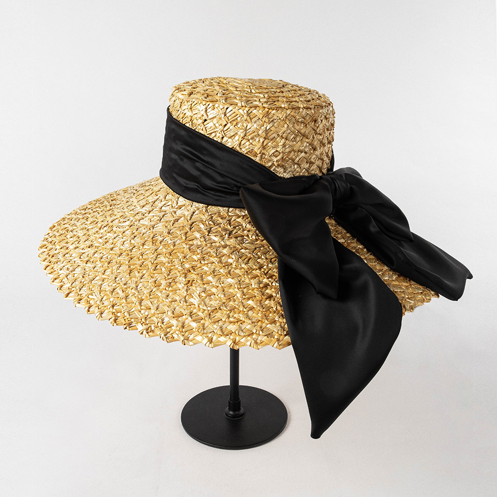 欧美春夏时尚手编大花瓣麦秆草大檐帽大蝴蝶结女士沙滩户外遮阳帽