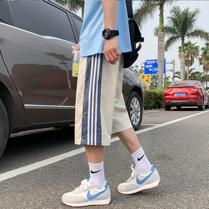    夏季新款排扣开叉七分裤男宽松运动条纹裤子图片