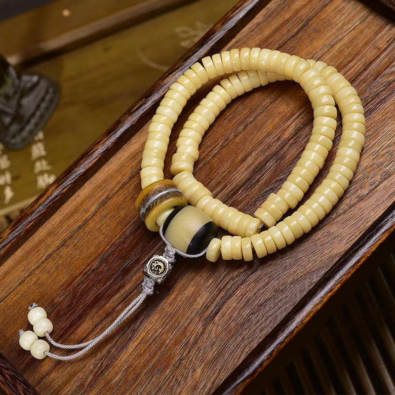 天然鸡油黄骆驼骨隔片佛珠项链