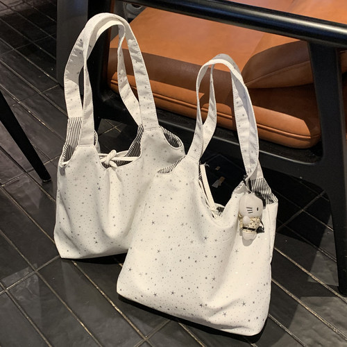 繁星点点~日韩绑带单肩包包女2026新款时尚学院风百搭手提帆布包