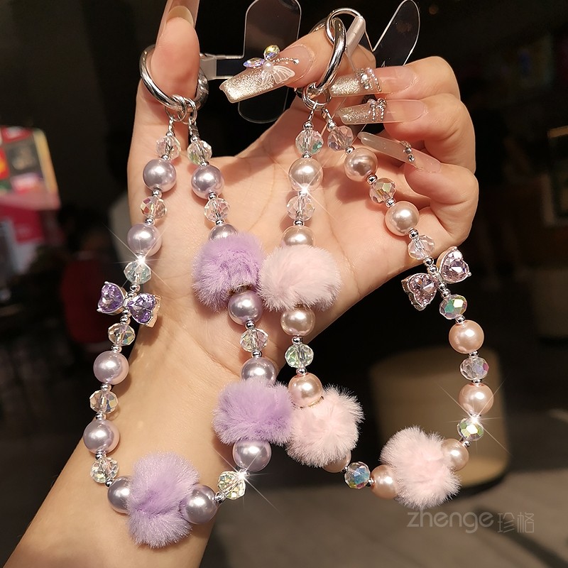 双域新款爆闪水钻蝴蝶结手机链挂绳短款ins冬季毛球串珠挂件女生户外旅游逛街钥匙包包壳套通用防丢高级感