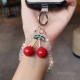双域大红樱桃透明水晶手机链女小清新手机壳挂件串珠手腕挂饰短款 户外旅游逛街防丢防盗手提链带子手机挂绳新