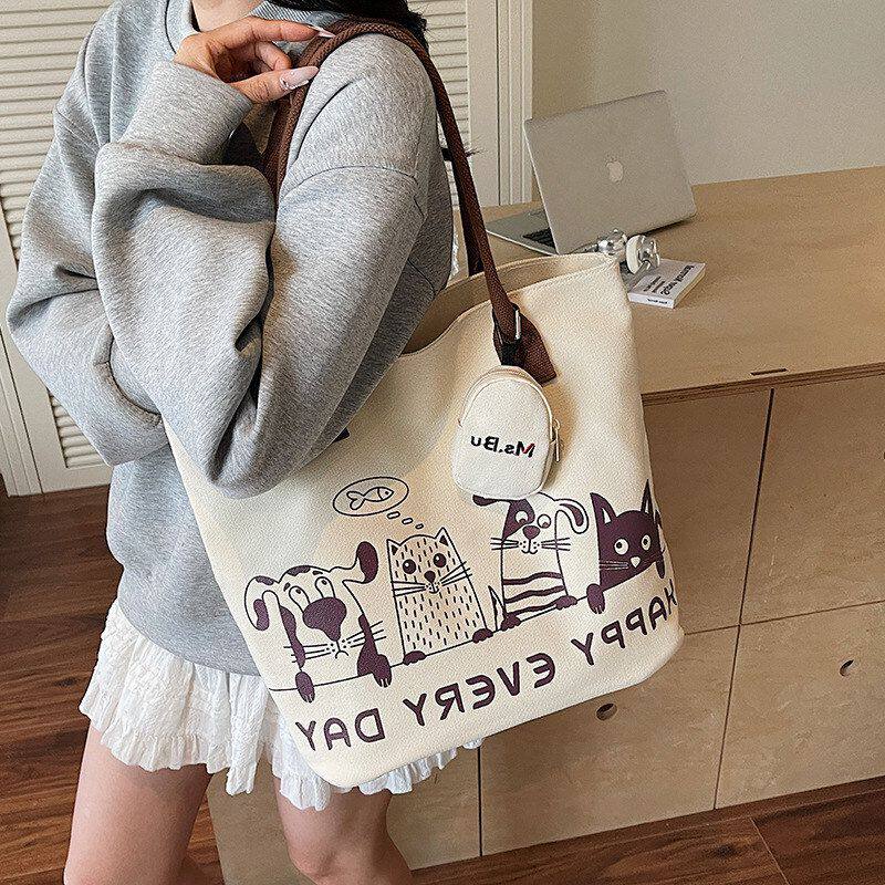 轻便通勤托特帆布包新款大容量大学生2026百搭女式单肩包包休闲包