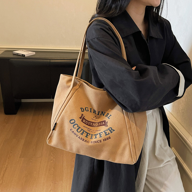 帆布包女2025新款日系手提单肩帆布袋大容量通勤购物袋拉链托特包