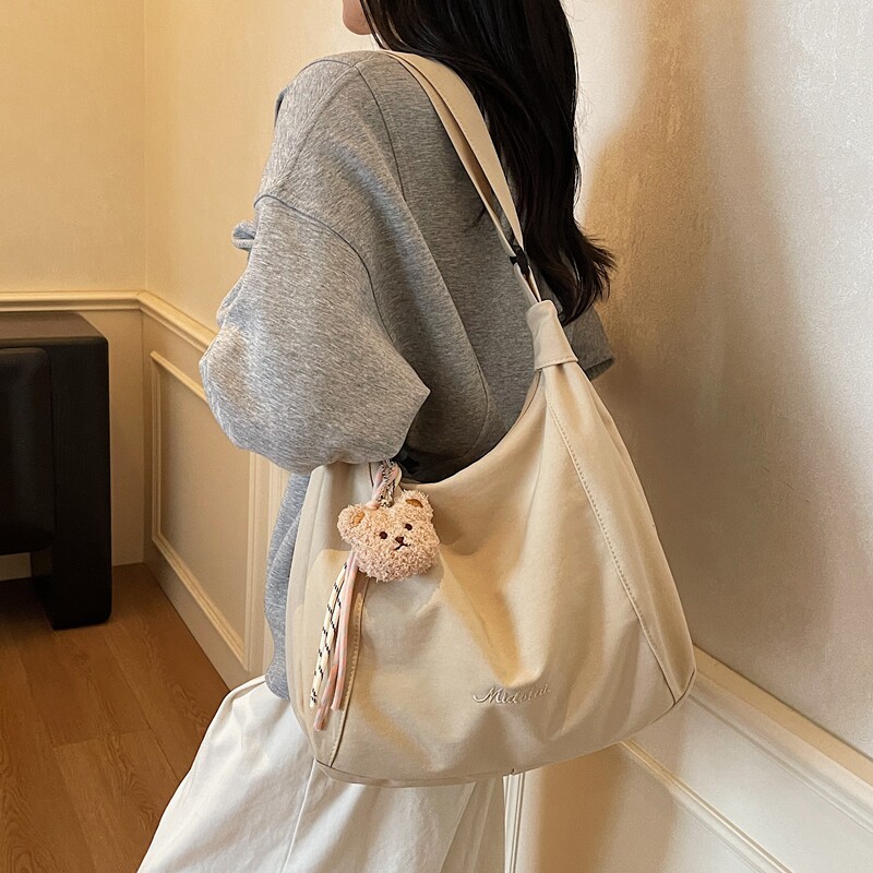 松弛感百搭通勤帆布托特包女2025新款大容量高级感轻便单肩斜挎包