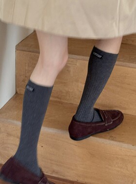 IOULOR秋冬韩系小腿袜带字母标休闲纯色有氧棉堆堆袜长筒袜