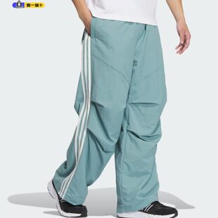 adidas阿迪达斯男裤拒水防泼运动休闲伞裤宽松长裤2025新款JI8644