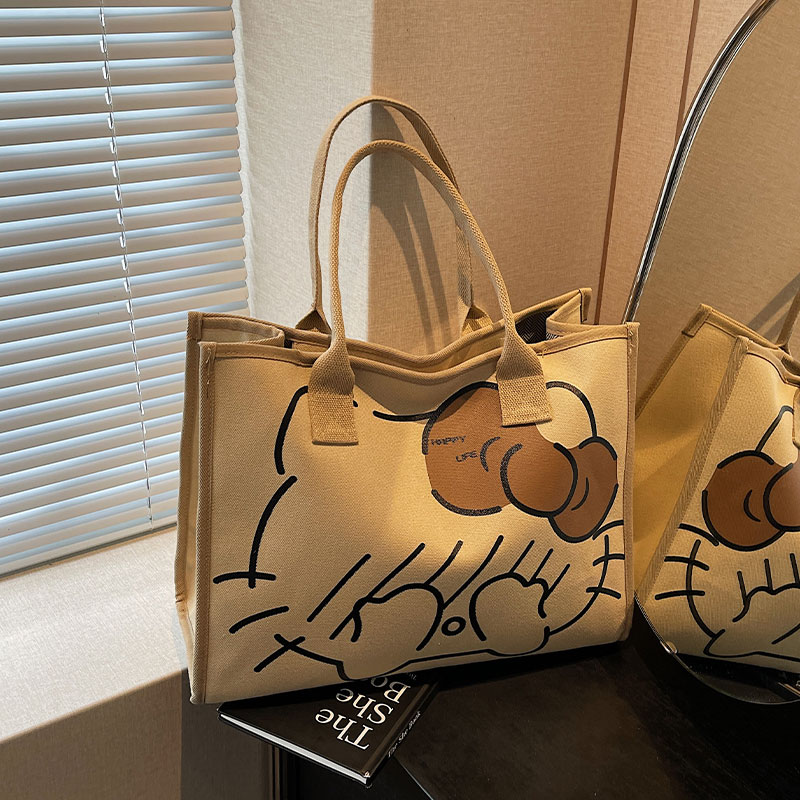 卡通帆布托特包包女2025新款休闲大容量通勤包外出轻便手提旅行袋