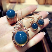 Gia đình Amber Amber tự nhiên Mexico Blue Poe Love Set Lan Po Ring Mặt dây chuyền Bông tai ba mảnh Giấy chứng nhận - Nhẫn