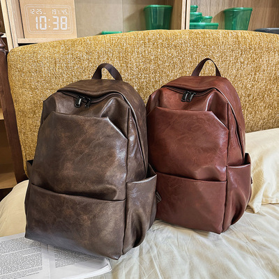 PU复古纯色大容量双肩包