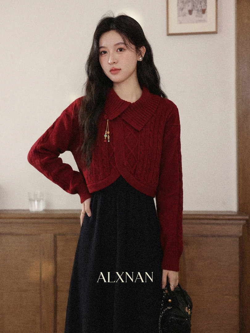 Red knit sweater worn by a model with a black skirt