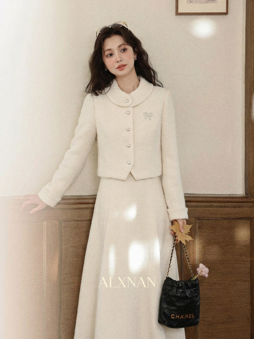 Cream two-piece skirt set worn by a model