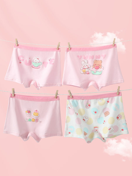 Four pairs of pastel pink cartoon boxer-style underwear hanging on a clothesline