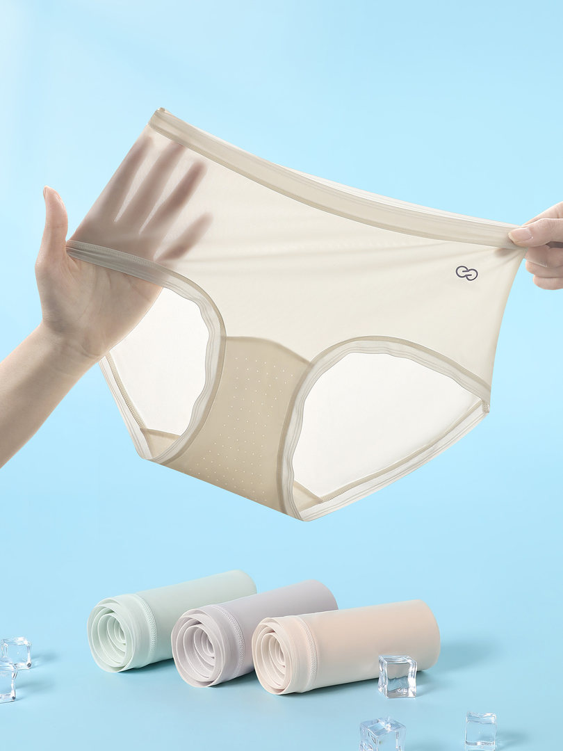 Beige sheer women’s underwear briefs displayed against a blue background