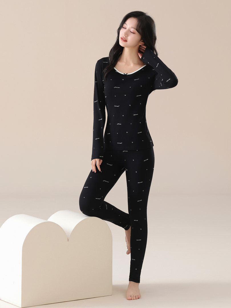 Black patterned long-sleeve loungewear set worn by a model