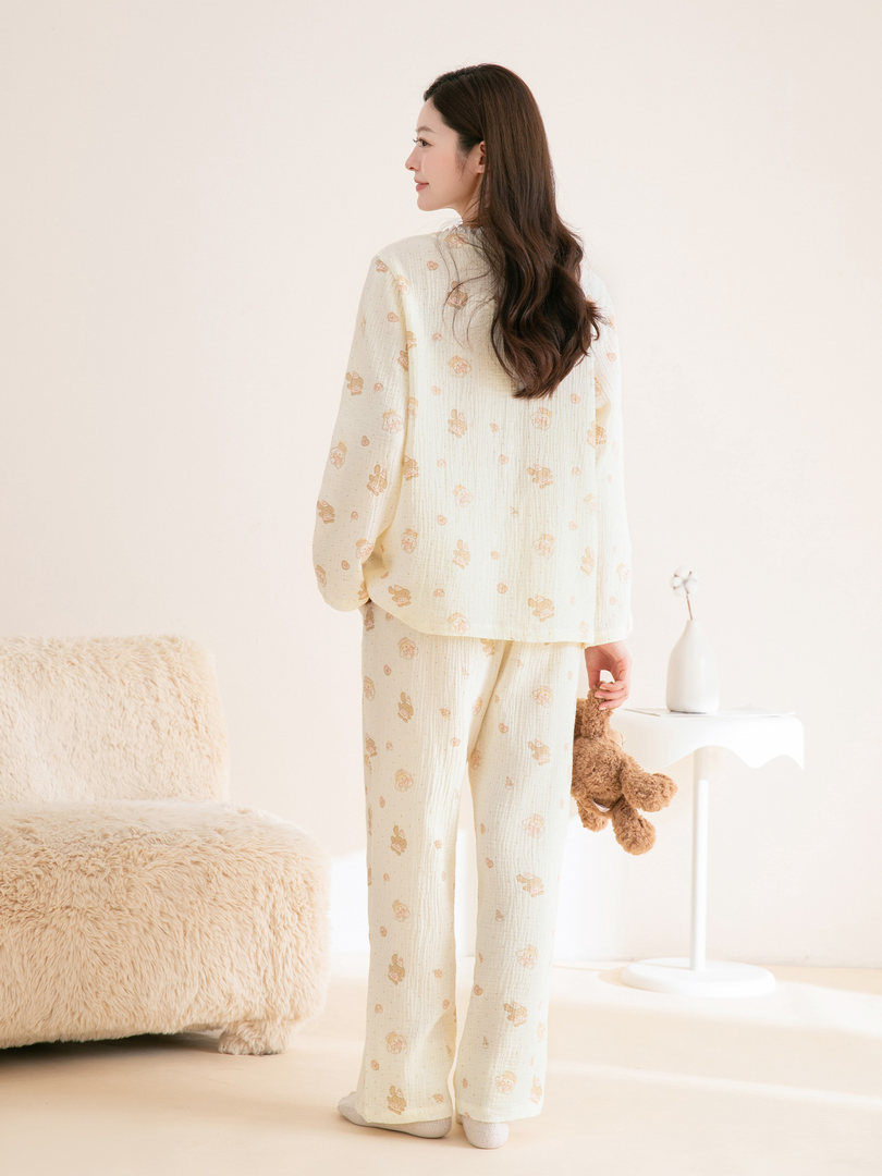 Woman wearing a cream patterned loungewear pajama set
